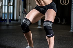 A man exercising while using a Compex TENS Wrap Unit