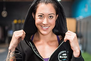 A woman wearing a Compex sweater